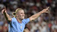 Ekspresi kegembiraan striker Manchester City, Erling Haaland, saat laga kontra Sevilla pada matchday pertama Grup G Liga Champions 2022/2023 di Stadion Ramon Sanchez Pizjuan, Rabu (7/9/2022) dini hari WIB. (Cristina Quicler/AFP)
