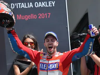 Pebalap Ducati, Andrea Dovizioso, berhasil menjuarai balapan MotoGP Italia di Sirkuit Mugello, Minggu (4/6/2017). Dovizioso menang dengan catatan waktu 41 menit 32,126 detik. (EPA/Luca Zennaro)