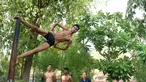 Seorang pesenam saat mengikuti sesi latihan Mallakhamb di CN Sports Academy di Ahmedabad, India, Sabtu (10/6). Mallakhamb adalah olahraga tradisional India yang sudah ada sejak abad ke-12. (AFP PHOTO / Sam PANTHAKY)