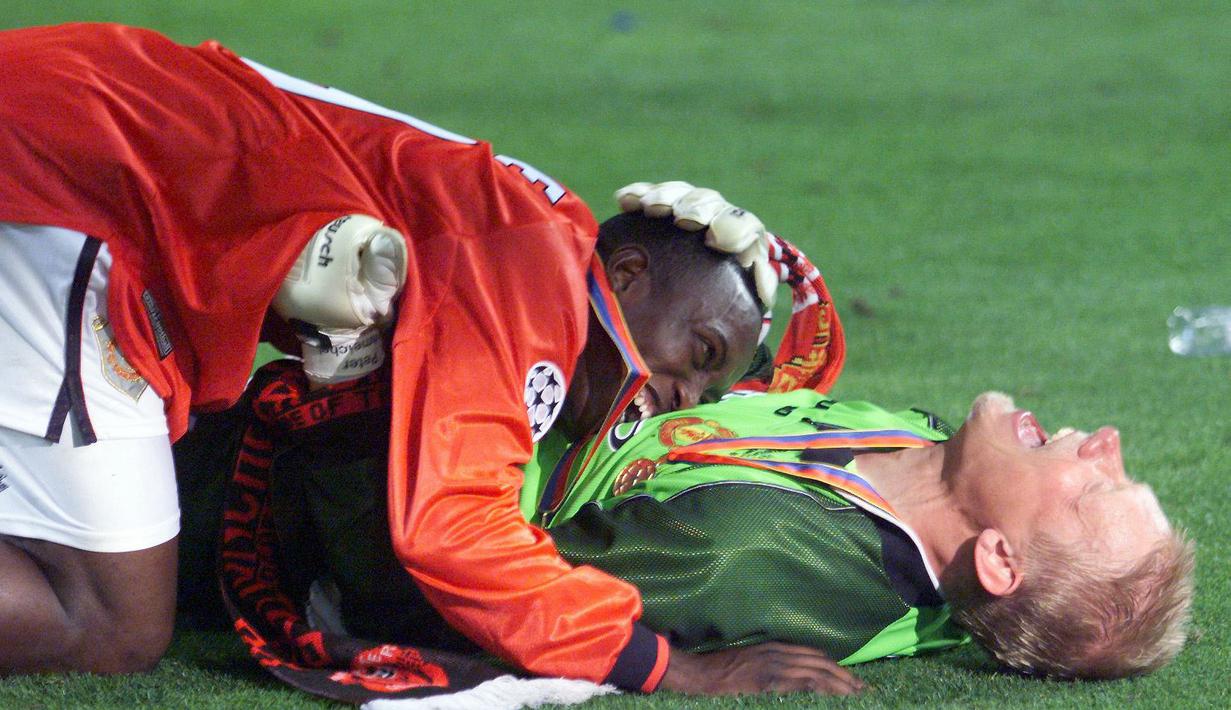 Peter Schmeichel bersama Dream Team asuhan Sir Alex Ferguson berhasil meraih trofi Liga Inggris, Piala FA, dan Liga Champions. (Foto: AFP/Eric Cabanis)