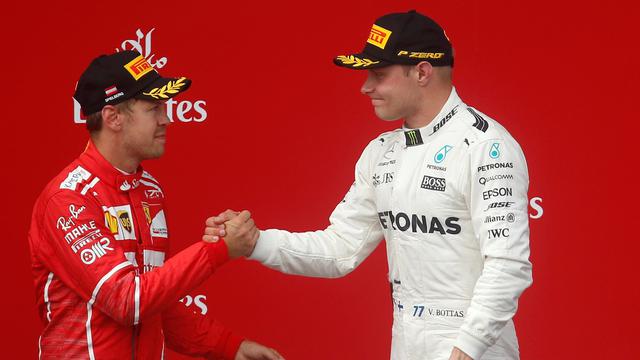 Sebastian Vettel dan Valtteri Bottas