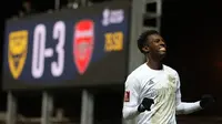 Penyerang Arsenal, Eddie Nketiah, berhasil mencetak dua gol dan membantu timnya meraih kemenangan 3-0 atas Oxford United pada laga putaran ketiga Piala FA di&nbsp;Kassam Stadium, Selasa (10/1/2023) dini hari WIB. (AFP/Adrian Dennis)