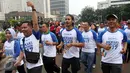 Suasana saat Bupati Lombok Barat, Fauzan Khalid bersama artis Chico Jericho melakukan olah raga di Kawasan HBKB Bunderan Hotel Indonesia Jakarta, Minggu (2/4). Nantinya acara itu akan di gelar di Mekaki Bay Lombok Barat. (Liputan6.com/Johan Tallo)