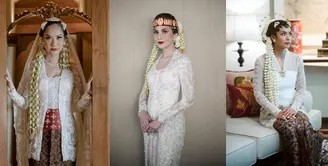 Di pernikahan ke-2 nya, BCL mengenakan kebaya kutubaru putih rancangan Didiet Maulana yang dipadukan obi merah dan kain batik coklat sebagai bawahan. Lengkap dengan veil panjang yang indah. [Foto: IG/Iluminen]