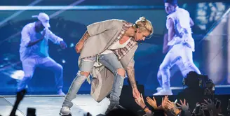 Mempunyai segudang jadwal tur dunia pada album 'Purpose' serta aktivitas yang sangat banyak menjadikan Justin Bieber jatuh sakit dan kelelahan. (AFP/Bintang.com)