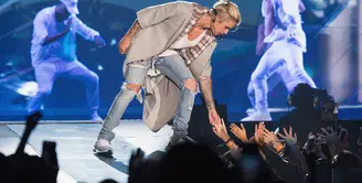 Mempunyai segudang jadwal tur dunia pada album 'Purpose' serta aktivitas yang sangat banyak menjadikan Justin Bieber jatuh sakit dan kelelahan. (AFP/Bintang.com)