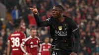Ousmane Dembele merayakan gol pembuka untuk Paris Saint-Germain di Anfield saat laga leg kedua perempat final Liga Champions 2025/2026 melawan Liverpool, 14 April 2026. (AFP/FRANK FIFE).