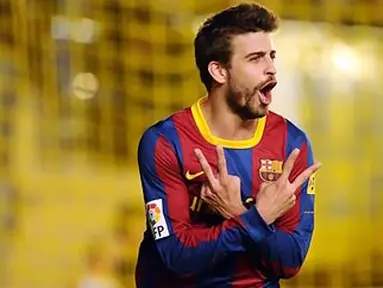 Bek Barcelona Gerard Pique merayakan gol tunggal kemenangan atas Villarreal dalam partai La Liga jornada 30 di El Madrigal, 2 April 2011. AFP PHOTO/JOSE JORDAN