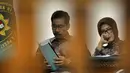 Romi Herton dan Istrinya Masyitoh saat menjalani sidang lanjutan di Pengadilan Tipikor, Jakarta, Kamis (4/12/2014). (Liputan6.com/Miftahul Hayat)
