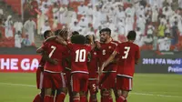 UAE's players celebrate after scoring a goal against Malaysia's team during their AFC qualifying football match for the 2018 FIFA World Cup / KARIM SAHIB / AFP
