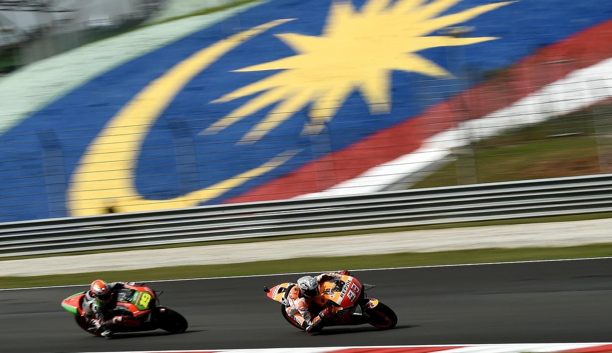 Marc Marquez menjadi yang tercepat dengan catatan waktu 2 menit 01,210 detik yang dicatat saat latihan bebas pertama MotoGP Malaysia, Jumat (28/10/2016). (AFP/Manan Vatsyayana)