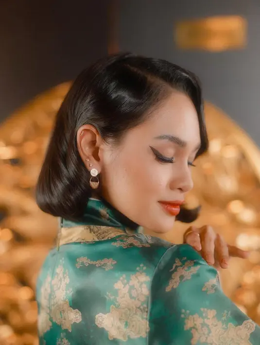 Andien kenakan cheongsam [Instagram/andienaisyah]