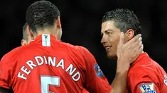 Manchester United's Cristiano Ronaldo celebrates with Rio Ferdinand after scoring the opening goal during English Premiership match against Everton at Old Trafford, on January 31, 2009. AFP PHOTO/ANDREW YATES