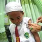 Program imunisasi anak yang dilakukan di berbagai Sekolah Dasar (SD) di Sumsel (Liputan6.com / Nefri Inge)