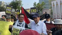 Amnesty International Indonesia dan aktivis pembela HAM mengadakan aksi solidaritas menuntut untuk mengakhiri serangan di Gaza. Aksi dilakukan di depan Kedutaan Besar Amerika Serikat, Jakarta Pusat, Jumat (27/10/2023). (Foto:Liputan6/Rifqy.A. Abiyya)