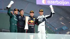 Sergio Perez, Pembalap Red Bull Racing, berhasil menyabet gelar juara pertama yang diikuti oleh Sebastian Vettel, Pierre Gasly, dan Charles Leclerc pada F1 GP Azerbaijan yang dihelat di Baku Street Circuit, Minggu (6/6/2021) malam WIB. (Foto: AFP/Ozan Kose)
