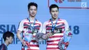 Ganda putra Indonesia, Kevin Sanjaya Sukomuljo/Marcus F Gideon usai mengalahkan Takuto Inoue/Yuki Kaneko (Jepang) di Final Indonesia Open 2018, Istora GBK, Jakarta, Minggu (8/7). Kevin/Marcus unggul 21-13, 21-16. (Liputan6.com/Helmi Fithriansyah)