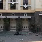 Puing-puing terlihat di halaman Gereja Santa Maria pascaledakan bom, Surabaya, Jawa Timur, Minggu (13/5). Dua orang tewas dan 13 orang menderita luka akibat ledakan di Gereja Santa Maria. (AP/Trisnadi)