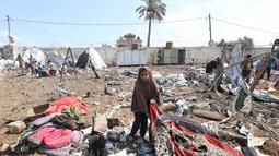 Serangan tersebut menghantam kamp pengungsi Palestina di Deir al-Balah. (Eyad BABA/AFP)