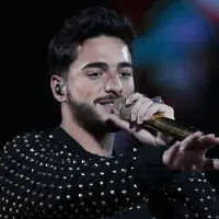 Penyanyi asal Kolombia, Maluma, kemalingan hingga menderita kerugian Rp11 miliar saat mendukung Timnas Kolombia di Rusia. (AFP/Paul Plaza)