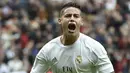 Pemain Real Madrid, James Rodriguez saat merayakan golnya ke gawang  Athletic Club Bilbao pada Laga Lanjutan pekan ke-24 La Liga Spanyol di Stadion Santiago Bernabeu,  Madrid. (AFP / Gerard Julien)