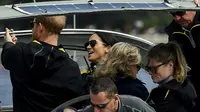 Pangeran Harry dan Meghan Markle di Sydney Harbour di hari pertama Invictus Games di Sydney, Australia, Minggu(21/10/2018). (BRENDAN ESPOSITO / POOL / AFP/Asnida Riani)