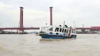 Sungai Musi yang menjadi ikon kota Palembang (Liputan6.com / Nefri Inge)