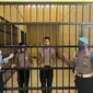 Dua oknum anggota Polda Papua Barat yang viral menjilat kue HUT TNI dijebloskan ke sel tahanan. (Istimewa)