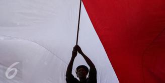 Bendera Indonesia dan lagu Indonesia raya berkumandang di penutupan Asian Games 2014 yang berlangsung di Incheon, Korea Selatan. (Liputan6.com)