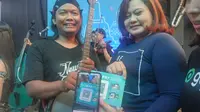 Gopay memfasilitasi musisi jalanan di Yogyakarta dengan kode QR untuk mempermudah pembayaran dan apresiasi. (Liputan6.com/ Switzy Sabandar)