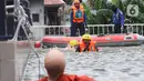 Peserta lomba Jakarta Fire and Rescue Competition 2022 di Pusdiklat Gulkarmat, Ciracas, Jakarta Timur, Senin (21/3/2022). Lomba tersebut diikuti oleh Dinas Penanggulangan Kebakaran dan Penyelamatan (Gulkarmat) sektor DKI Jakarta yang digelar 21 hingga 25 Maret 2022. (Liputan6.com/Herman Zakharia)