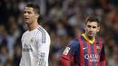 Lionel Messi dan Cristiano Ronaldo merupakan dua megabintang yang terlibat persaingan tersengit sepanjang masa. Kedua pemain yang telah meraih banyak trofi dan mencetak rekor luar biasa ini berlomba-lomba membuktikan diri sebagai yang terbaik di dunia. (AFP/Dani Pozo)