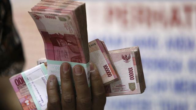 Ilustrasi transaksi tunai.