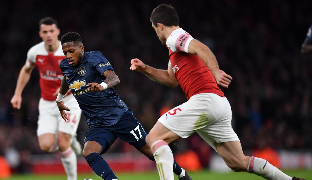 Aksi gelandang Man United, Fred pada laga lanjutan Premier League yang berlangsung di Stadion Emirates, London, Minggu (10/3). Arsenal menang 2-0 atas Man United. (AFP/Ben Stansall)
