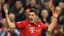 Pemain Bayern Munich, Robert Lewandowski  berada di urutan kedua top skor Liga Champions dengan total 7 gol. (AFP Photo/Christof Stache)