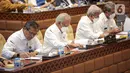 Menteri Pekerjaan Umum dan Perumahan Rakyat (PUPR) Basuki Hadimuljono (kedua kiri) mengikuti rapat kerja bersama Komisi V DPR RI di Kompleks Parlemen, Senayan, Jakarta, Selasa (17/1/2023). Rapat tersebut membahas tentang pembahasan program-program Kementerian PUPR tahun 2023 dan evaluasi pelaksanaan anggaran tahun 2022. (Liputan6.com/Faizal Fanani)