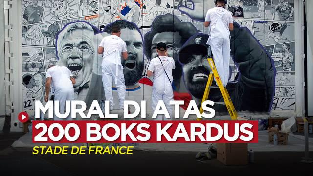 Berita video mural unik bergaya komik yang dibuat di atas 200 boks kardus hadir jelang laga Final Liga Champions, Liverpool vs Real Madrid.