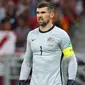 Mathew Ryan. Kiper Australia berusia 30 tahun yang baru bergabung dengan FC Copenhagen di awal musim 2022/2023 ini menjadi pemain aktif dengan penampilan terbanyak bagi Tim Socceroos dengan mengoleksi 75 caps sejak melakukan debut pada 5 Desember 2012. Piala Dunia 2022 Qatar akan menjadi Piala Dunia ketiganya, setelah selalu tampil dalam 2 edisi sebelumnya, 2014 dan 2018. Dari kedua edisi tersebut ia selalu tampil dalam 6 laga Timnas Australia yang selalu tersingkir di fase grup. (AFP/Karim Jaafar)