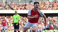 Ekspresi gembira Declan Rice setelah mencetak gol kemenangan bagi Arsenal di babak tambahan waktu saat melawan MU dalam pertandingan pekan keempat Liga Inggris 2023/2024 yang berlangsung di Emirates Stadium, London, Senin (4/9/2023) dini hari WIB. (AFP/Glyn Kirk)