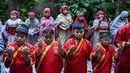 Sejumlah pelajar dari pondok pesantren Muhammadiyah mengikuti salat Istisqa untuk memohon turunnya hujan di tengah kekeringan berkepanjangan akibat fenomena El Niño di Surabaya, Jawa Timur, Kamis (22/10/2026). (JUNI KRISWANTO/AFP)