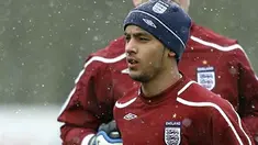England Striker Theo Walcott warms up preparations for the March 26 international friendly match against France at London Colney, North London, on March 24, 2008. AFP PHOTO/GLYN KIRK 