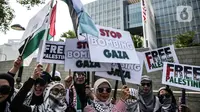 Terdengar dari mobil komando, demonstrasi hari ini merupakan aksi damai untuk menolak penjajahan Israel dengan suara takbir yang terus bergema. (Liputan6.com/Faizal Fanani)