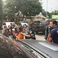 Perempuan yang ikut digiring polisi bersama pembunuh Dufi (Liputan6.com/Nanda Perdana)
