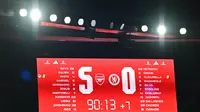 Skor 5-0 menunjukkan hasiil akhir pertandingan antara Arsenal kontra Chelsea di Liga Inggris 2023/2024 hari Rabu (24/04/2024) dini hari WIB. (GLYN KIRK / AFP)