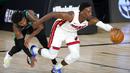 Pebasket Miami Heat, Bam Adebayo, berusaha melewati pebasket Boston Celtics, Marcus Smart, pada gim pertama final Wilayah Timur playoff NBA di SPN World of Sports Complex, Selasa (15/9/2020). Heat menang dengan skor 117-114. (AP/Mark J. Terrill)