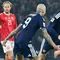 Gelandang Skotlandia #04 Scott McTominay (tengah) merayakan gol pembuka dalam pertandingan kualifikasi Piala Dunia 2026 zona Eropa antara Skotlandia dan Denmark di Hampden Park, Glasgow, Rabu (19-11-2025) dini hari WIB. (ANDY BUCHANAN/AFP)