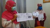 Sejumlah petugas medis melaporkan akun-akun Facebook yang diduga menyudutkan dan memfitnah ke Polda Gorontalo. (Foto: Liputan6.com/Arfandi Ibrahim)