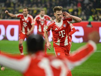 Joshua Kimmich menjadi pencetak gol penentu kemenangan dalam laga lanjutan Liga Jerman 2025/2026 antara Borussia Dortmund melawan Bayern Munchen di Signal Iduna Park, Sabtu (28/02/2026) waktu setempat. (AFP/Ina Fassbender)