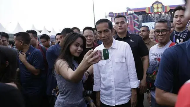 Jokowi nonton WTF 2018 (Hak Cipta: KapanLagi.com®/Agus Apriyanto/ssm)