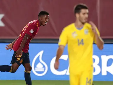 Pemain Spanyol, Ansu Fati, melakukan selebrasi usai mencetak gol ke gawang Ukraina pada laga UEFA Nations League Estadio Alfredo Di Stefano, Senin (7/9/2020). Spanyol menang 4-0 atas Ukraina. (AP Photo/Bernat Armangue)